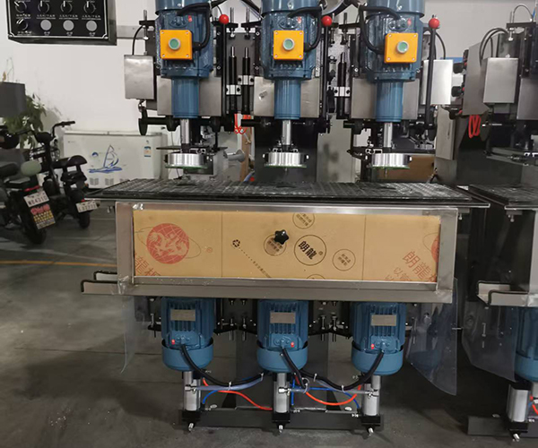 Three-head drilling machine